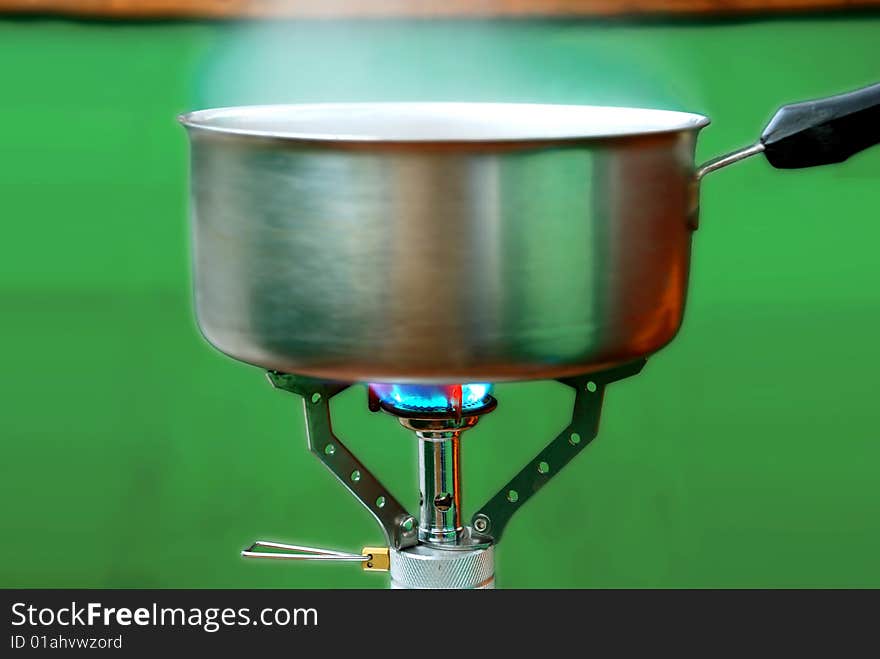 A stainless steel pan on a stove. A stainless steel pan on a stove