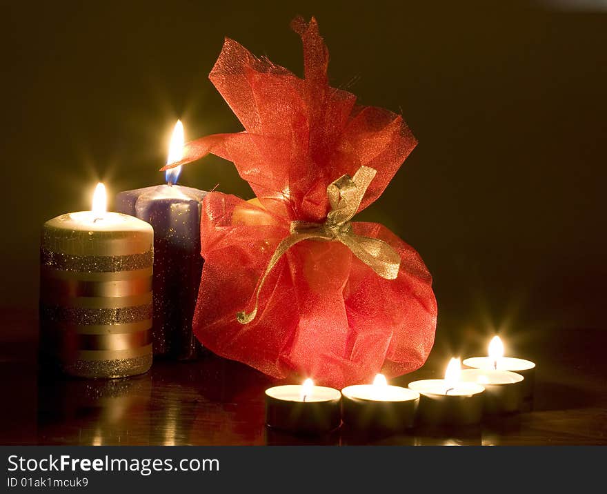 Close up on christmas candles and gift. Close up on christmas candles and gift