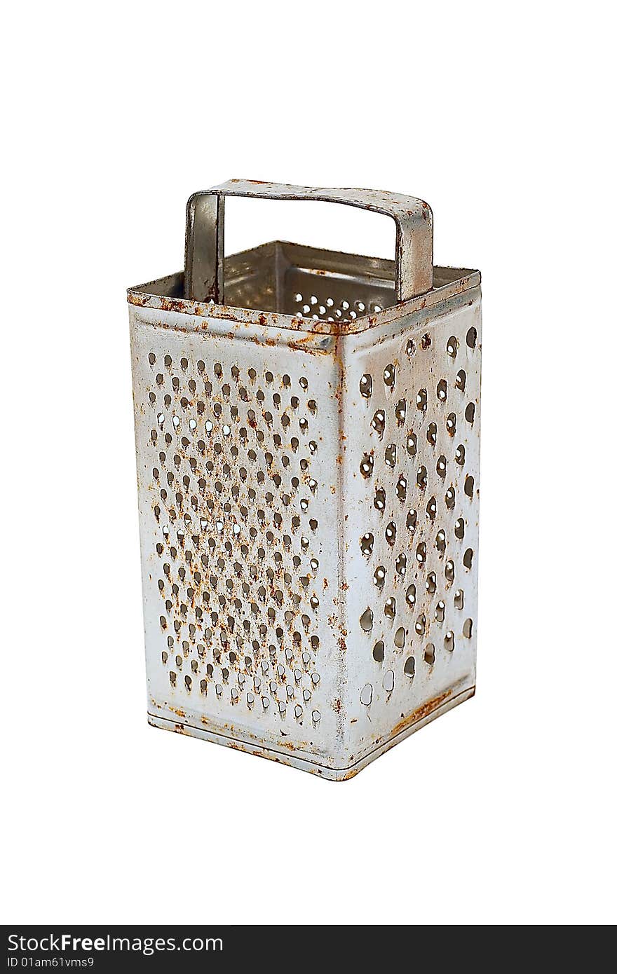 Old grater with use traces. It is isolated on a white background. Old grater with use traces. It is isolated on a white background.