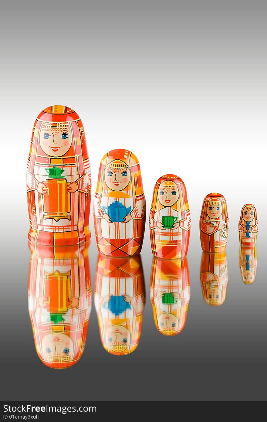 An isolated view of wooden Russian babushka or nesting dolls. An isolated view of wooden Russian babushka or nesting dolls.