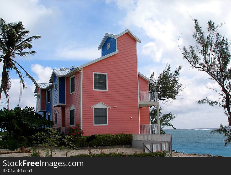 A beautiful and colourful beachfront home on the Caribbean island of Grand Cayman. A beautiful and colourful beachfront home on the Caribbean island of Grand Cayman.