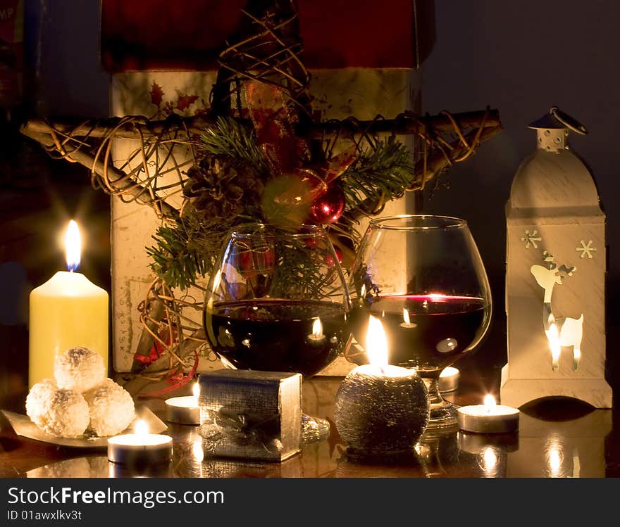 Christmas decoration with gift, wine and candles