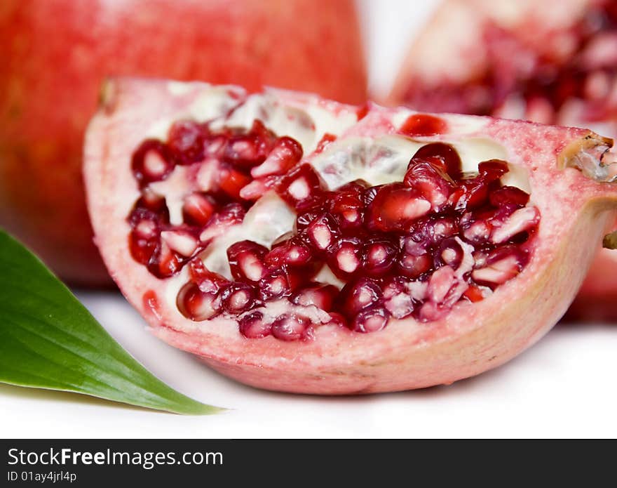 Pomegranate seeds isolated on white