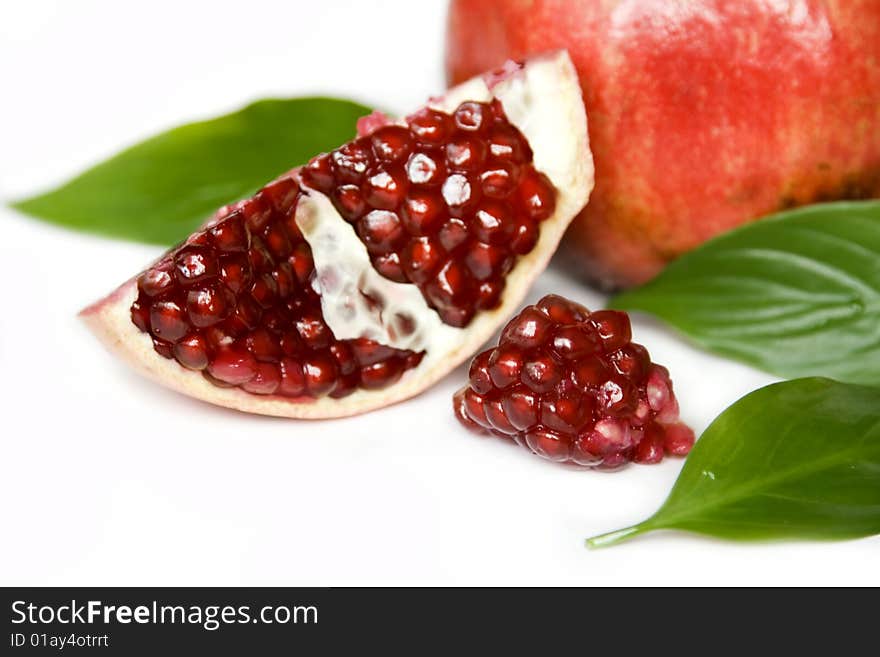 Pomegranate seeds isolated on white