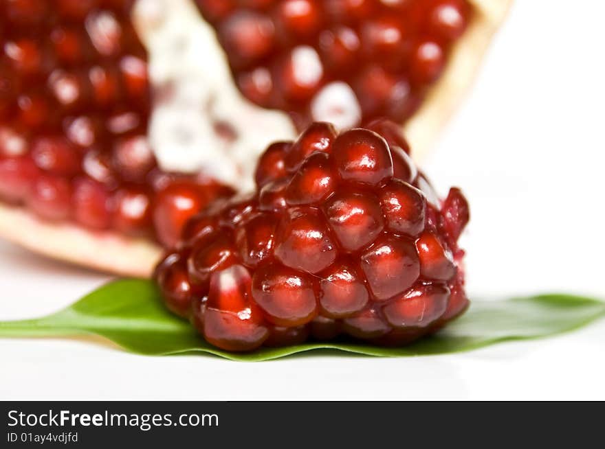 Pomegranate seeds isolated on white