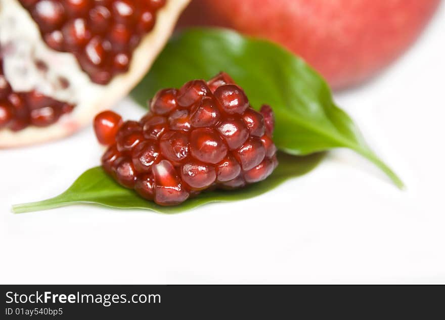 Pomegranate seeds isolated on white