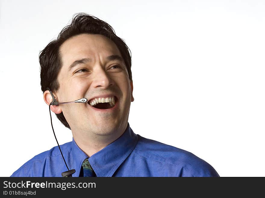 Man wearing a telephone headset having a conversation. Man wearing a telephone headset having a conversation