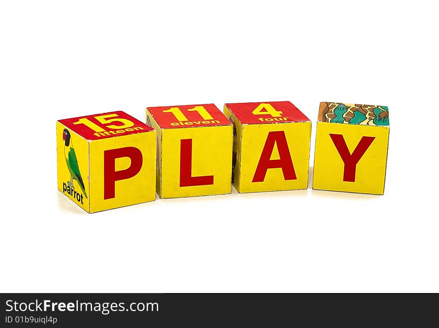 Word PLAY made of children's cubes. Studio shooting.