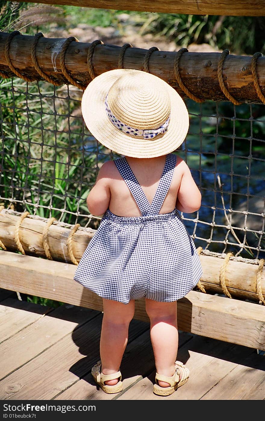 Cute Little Girl On Bridge