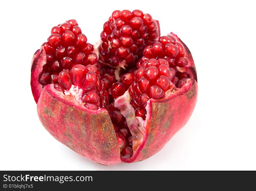 Open pomegranate isolated on white background