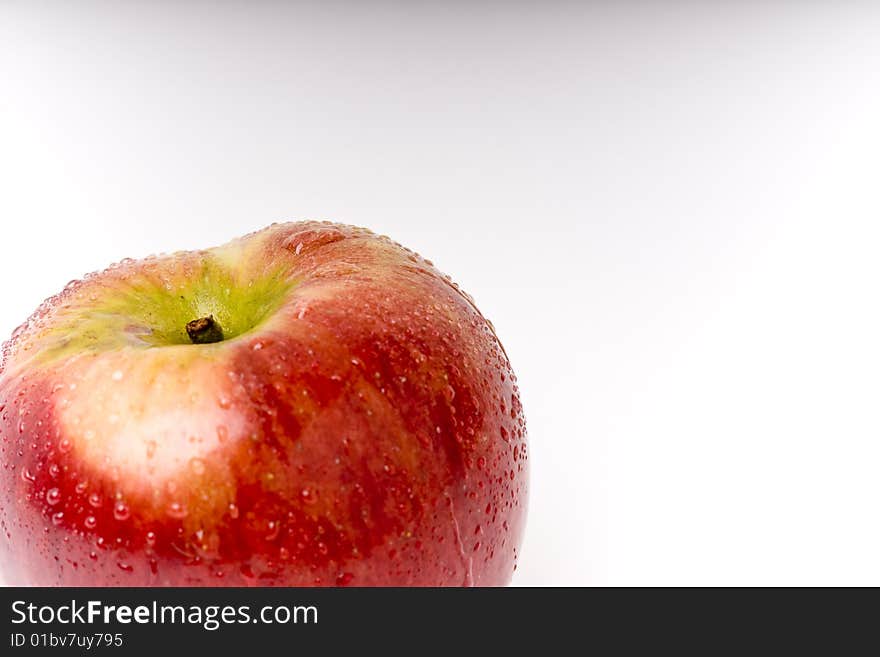 Red and green apple with water on it. Red and green apple with water on it