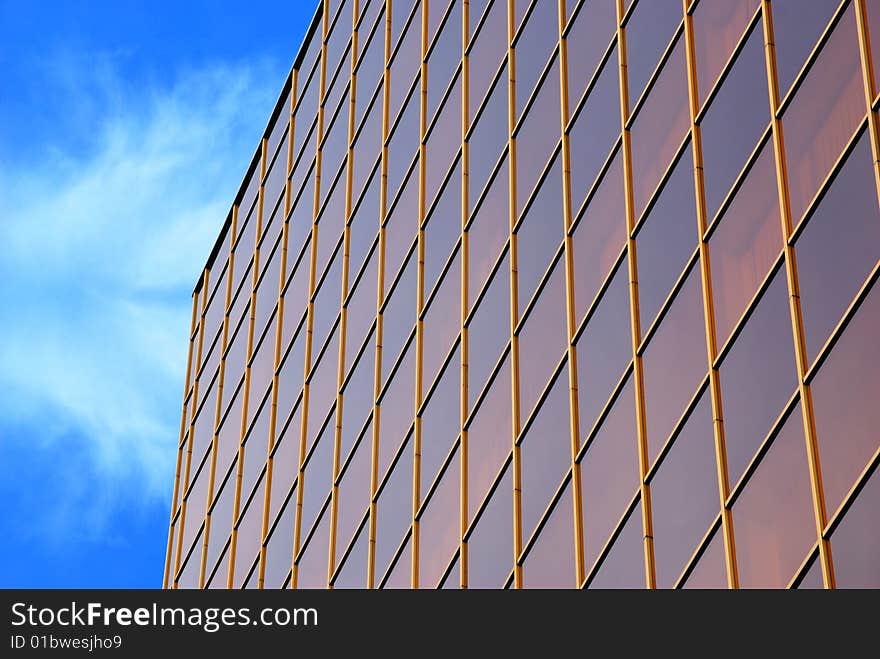 Office building and sky with clouds