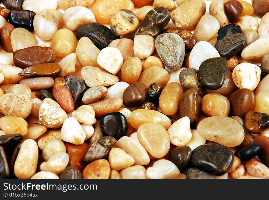 Colorful mix of round shiny pebbles and stones. Colorful mix of round shiny pebbles and stones