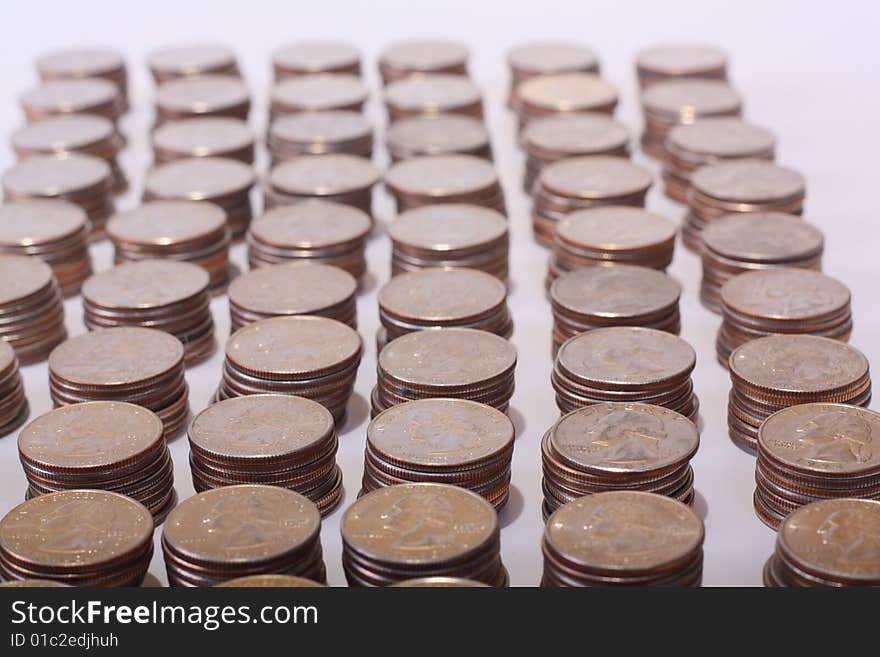 Stacks of quarters with George Washington showing on each.