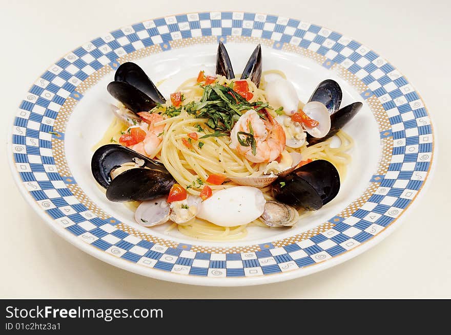 Italy seafood noodles on white dish