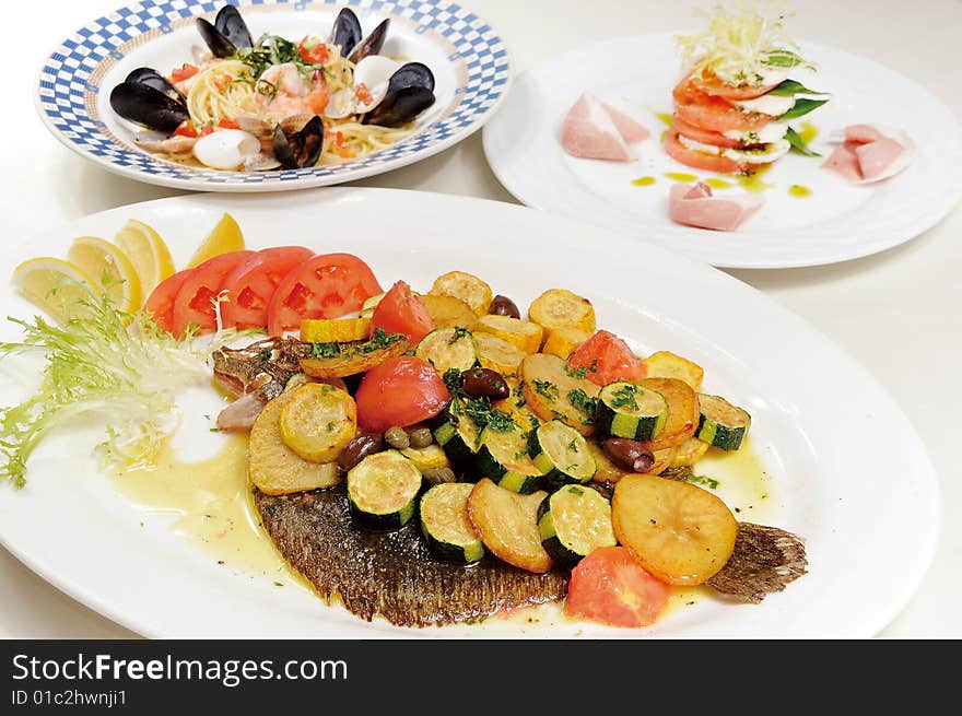 A fried fish with fruit