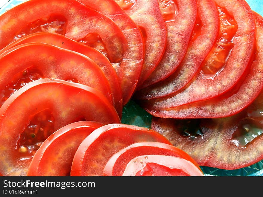 Red and very healthy tomatoes on the table.