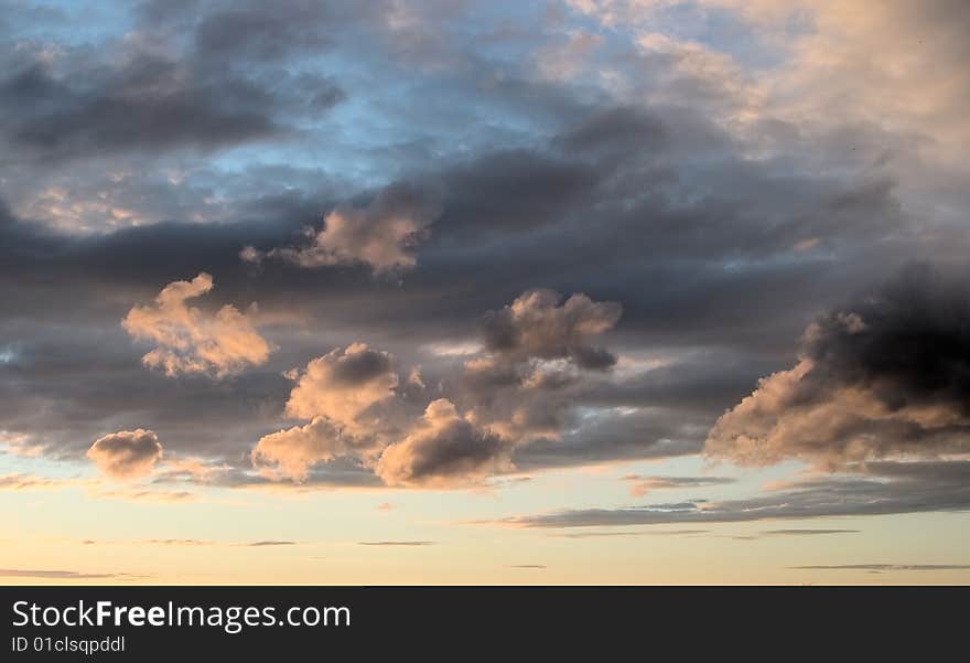 Natural photo of the sky,evening, summer, northern hemisphere. High plumose clouds are visible. Windy weather.