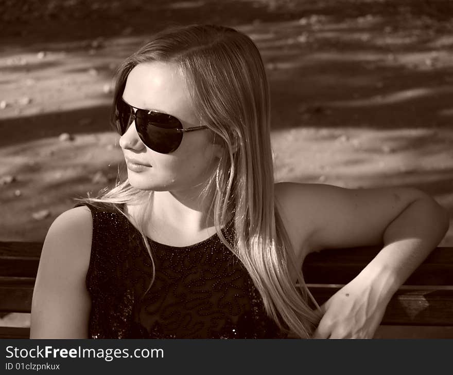 Young Woman With Sun Glasses In Sepia