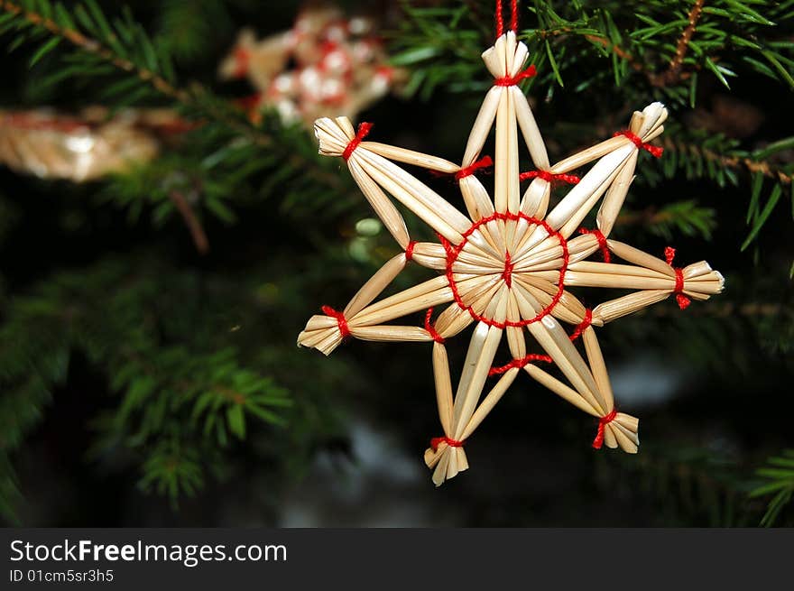 A straw star on the Christmas Tree