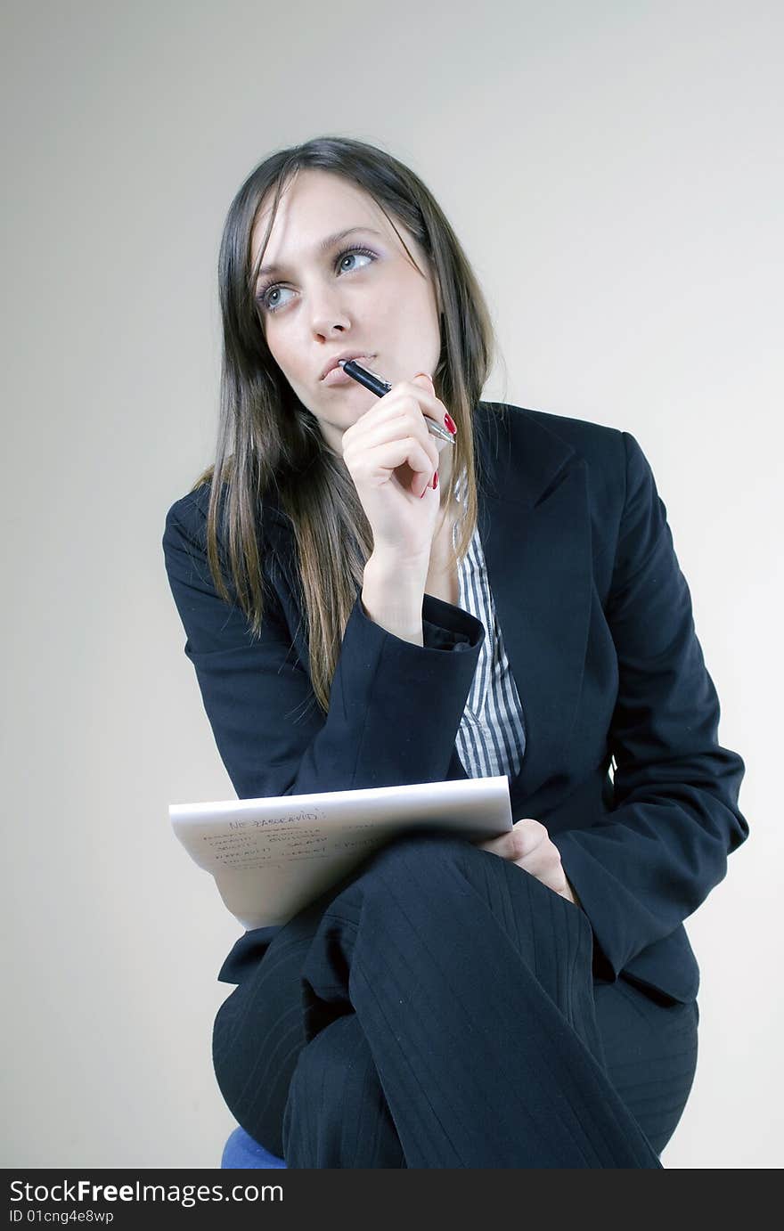 Young attractive secretary thinking