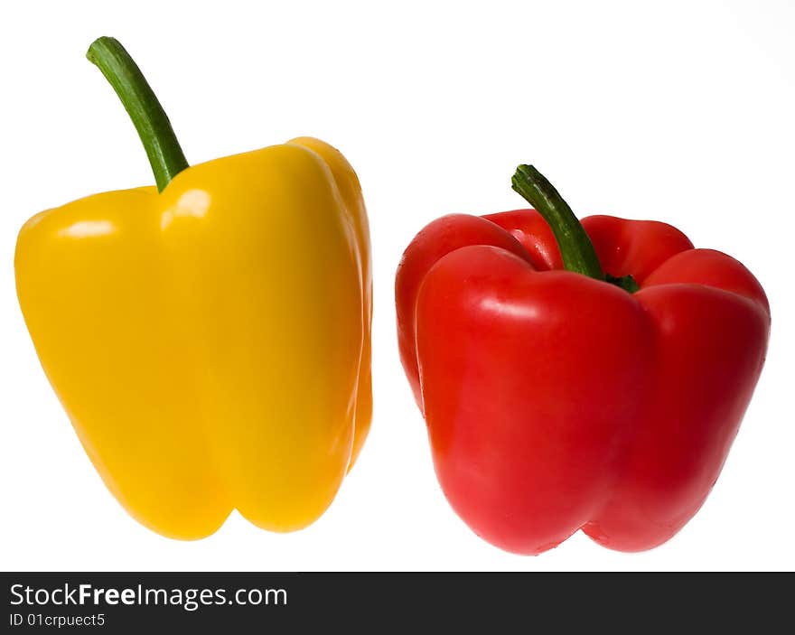 Two peppers, yellow and red, isolated