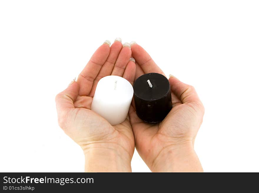 Two candles in hands on white background