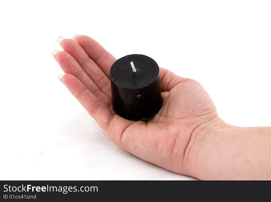 One candle in hand on white background.