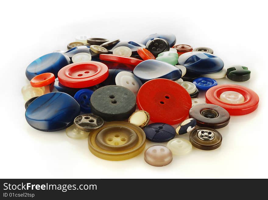 Heap (mineral deposit) of the buttons on a white background. Heap (mineral deposit) of the buttons on a white background