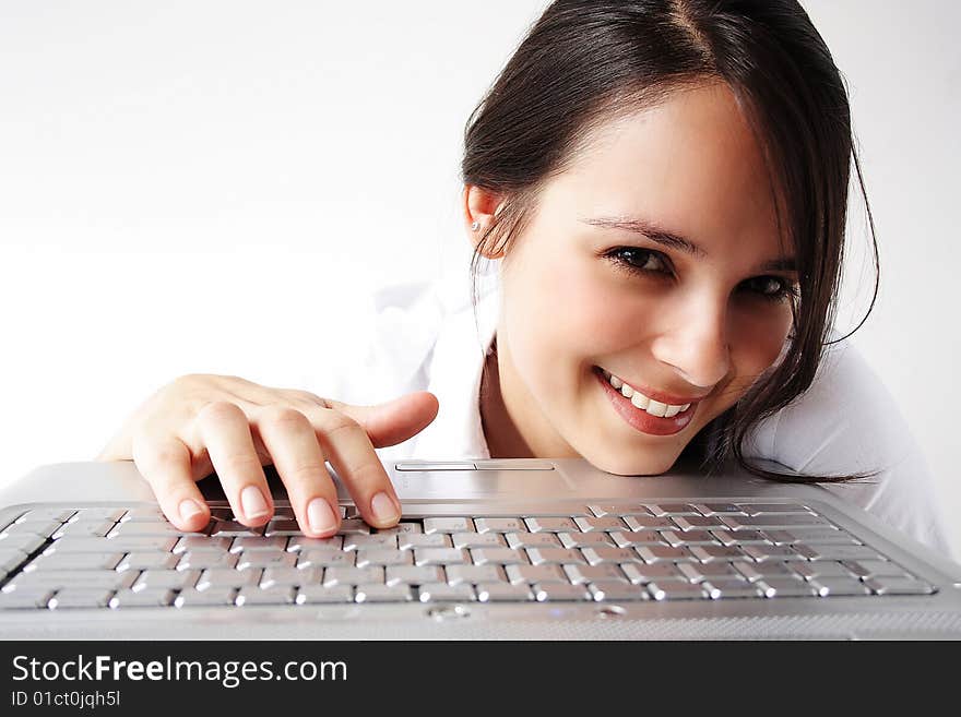 Beautiful young woman with her laptop looking to the camera. Beautiful young woman with her laptop looking to the camera.