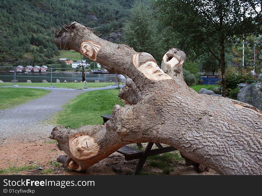 A nice sculpture of faces on tree in Norway. A nice sculpture of faces on tree in Norway