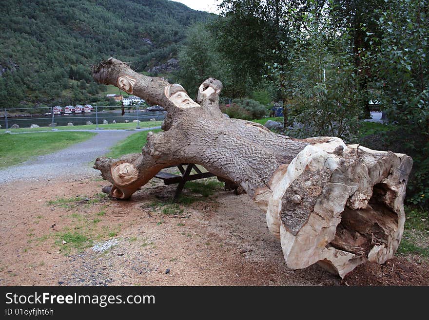 A nice sculpture of faces on tree in Norway. A nice sculpture of faces on tree in Norway