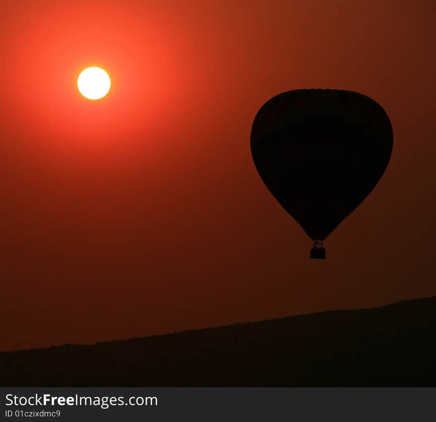 Balloon over a mountain