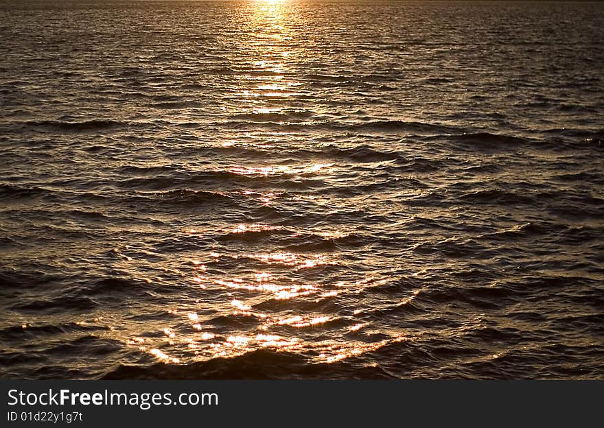 The surface of the lake water clean. Autumn, a sunset.