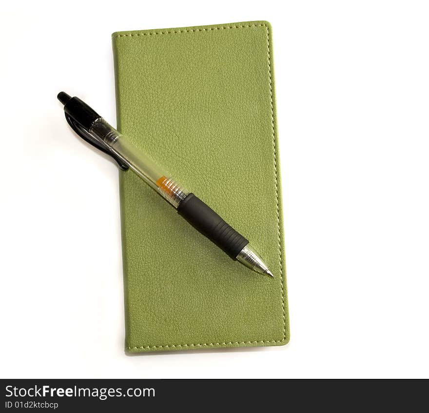 Green Notebook And Pen