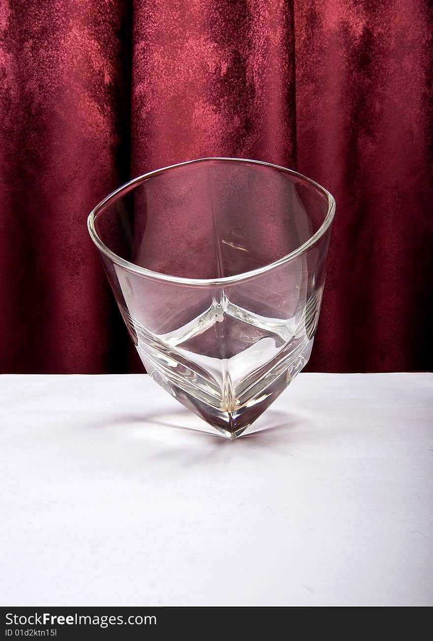 Glass shot while spinning on its sharp corner. Glass shot while spinning on its sharp corner.