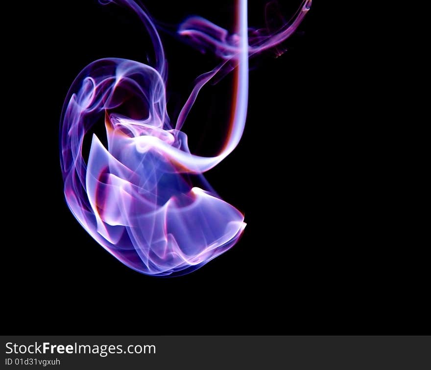 Smoke cloud on a black background with illumination