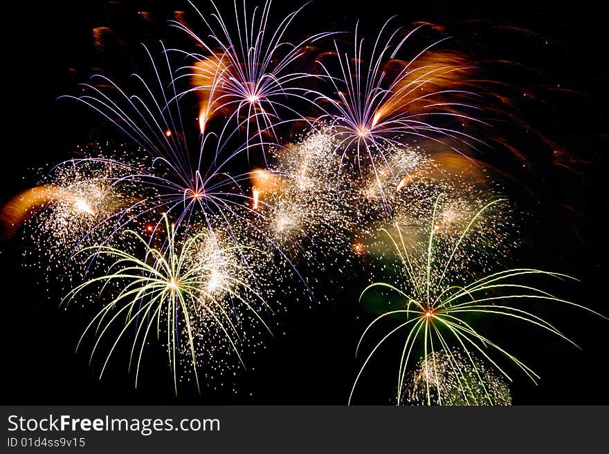 Bright colored fireworks on black background