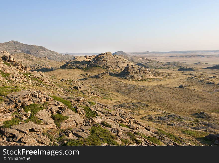 Mountain with rocks under blue sky. Mountain with rocks under blue sky