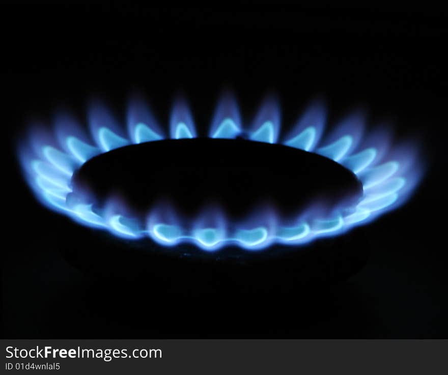 Flames of gas stove in the dark