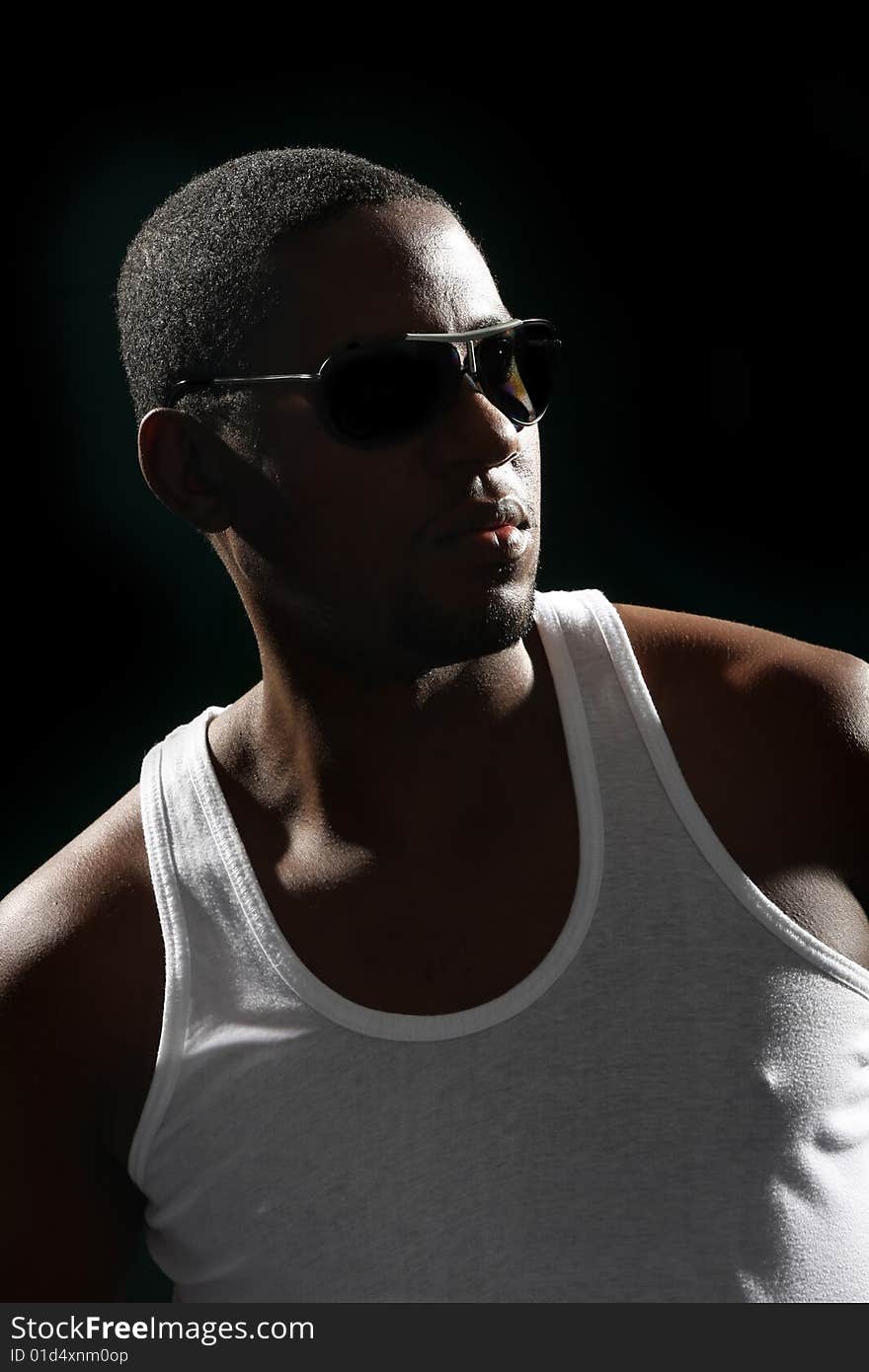 Young african american male on black background