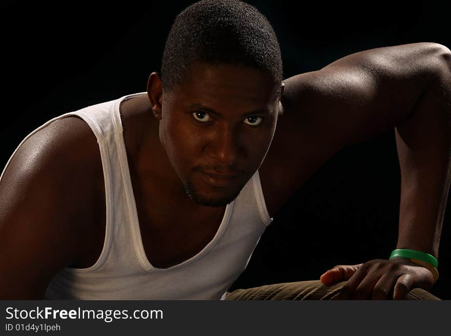 Young african american male on black background