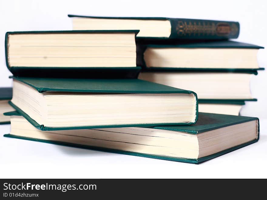 Pile of green books on white