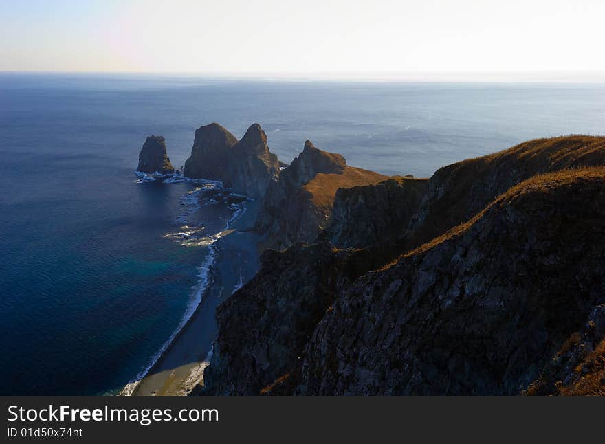 Sunset on cape of Four Rocks. The Far East. Russia. Sunset on cape of Four Rocks. The Far East. Russia.