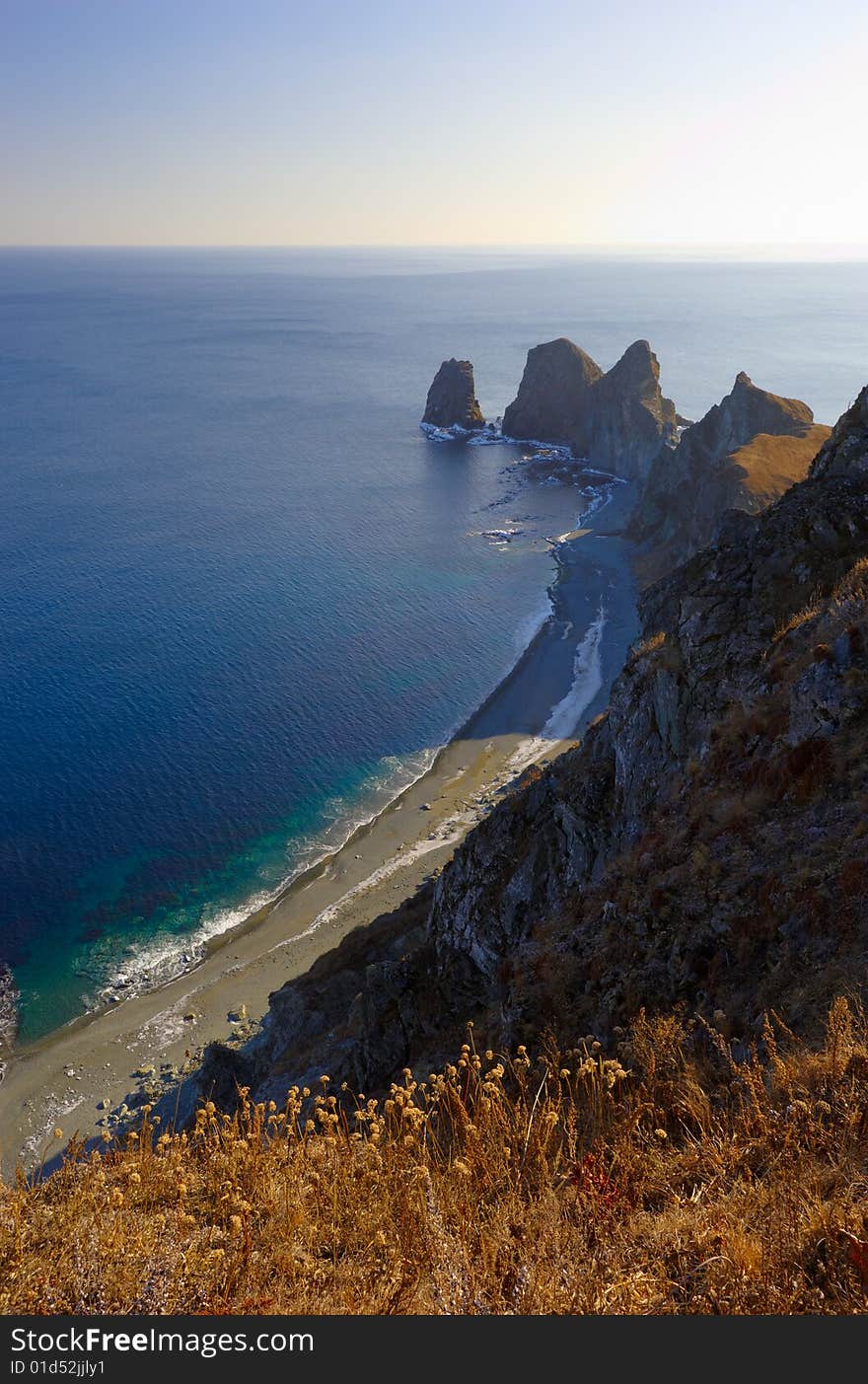 Sunset on cape of Four Rocks. The Far East. Russia. Sunset on cape of Four Rocks. The Far East. Russia.