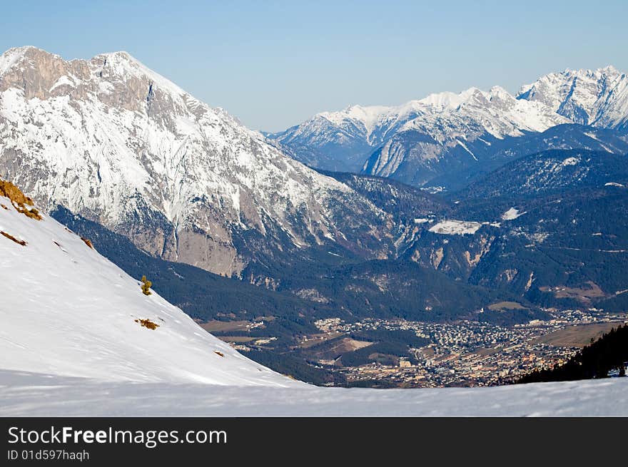 Winter mountains view on town in the valley