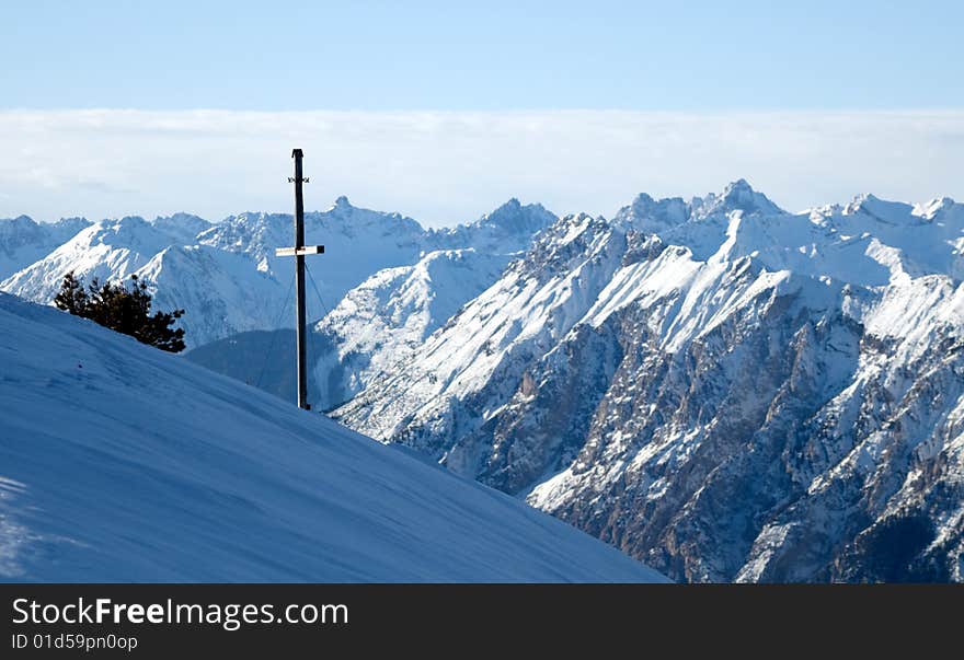 Winter mountains with cross