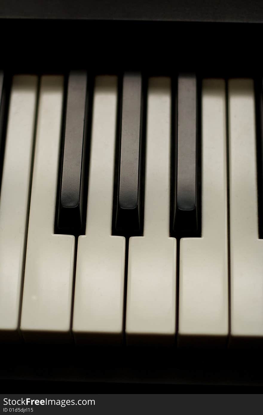 Close up of piano keys in black and white