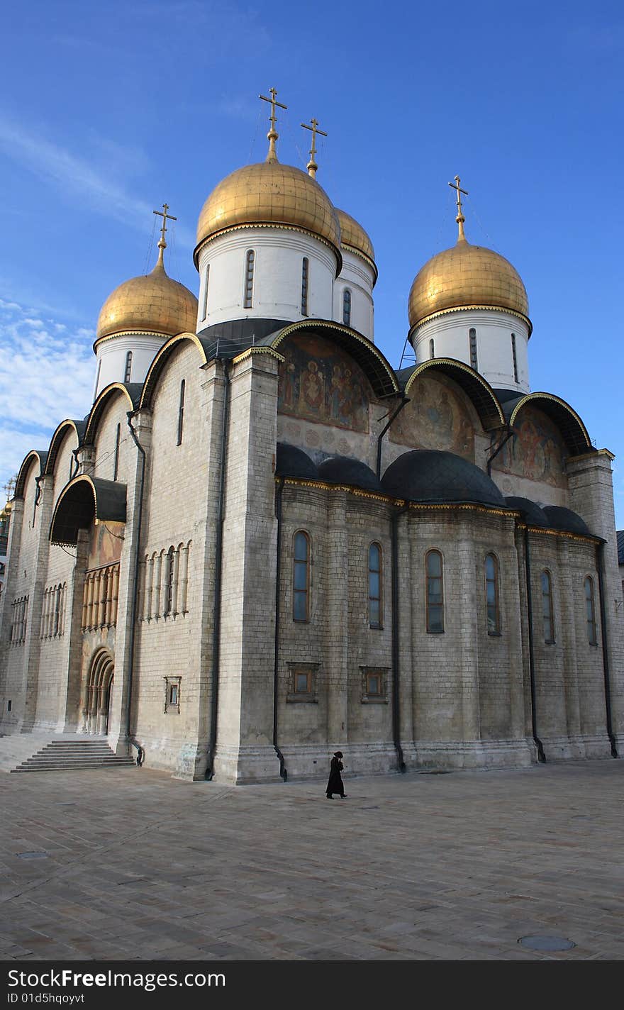 Ortodox cathedral and a figure of woman