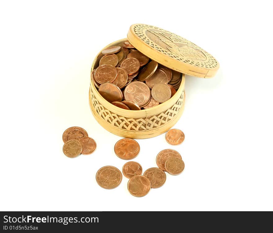 Carved wooden box full of coins, isolated on a white background